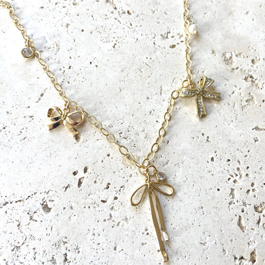 BOUTIQUE BOW CHARM NECKLACE